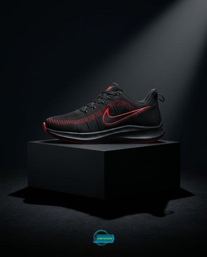 Black and red Nike premium mesh running sneakers for men on a black pedestal.